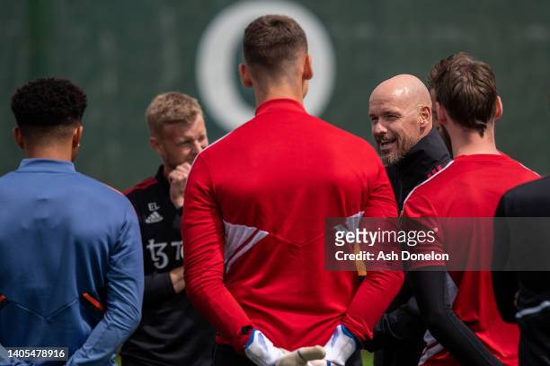 Manager Erik ten Hag of Manchester United talks to players during a first team training session at Carrington Training Ground on June 27, 2022 in...