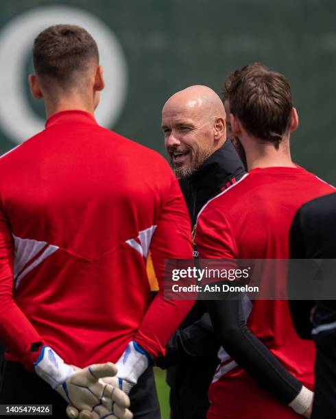 Manager Erik ten Hag of Manchester United talks to players during a first team training session at Carrington Training Ground on June 27, 2022 in...