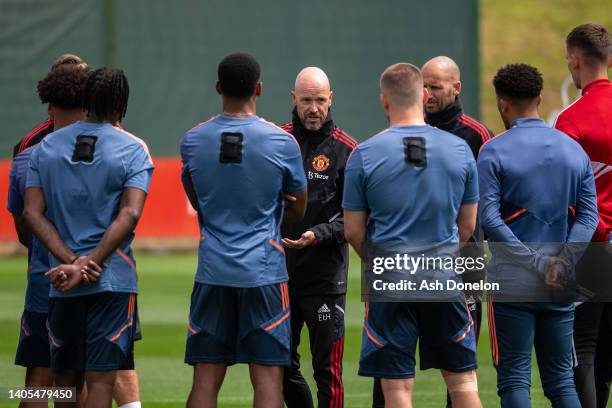 Manager Erik ten Hag of Manchester United talks to players during a first team training session at Carrington Training Ground on June 27, 2022 in...