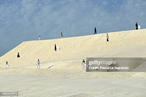 Models walk the runway during the "Le Papier " Jacquemus' Fashion Show on June 27, 2022 in Arles, France.