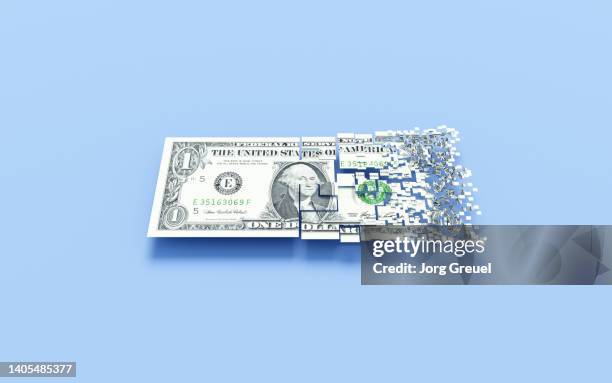 dissolving dollar banknote - devaluación fotografías e imágenes de stock