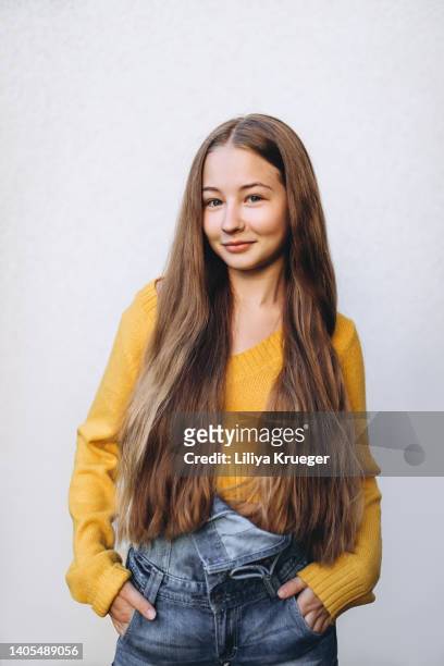 portrait of teenage girl on an empty neutral background. - 15 years girl bare stock pictures, royalty-free photos & images