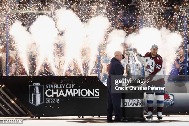 Gabriel Landeskog of the Colorado Avalanche is awarded the Stanley Cup from Deputy NHL Commissioner Bill Daly after Game Six of the 2022 NHL Stanley...