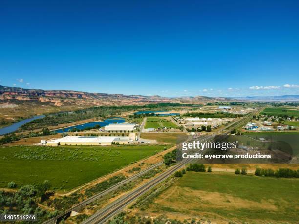 rural highway and farms western usa small town america views alongside agriculture and rural elements  photo series - fruita colorado stock pictures, royalty-free photos & images
