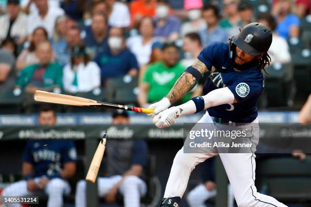 Crawford of the Seattle Mariners breaks his bat during the first inning against the Baltimore Orioles at T-Mobile Park on June 27, 2022 in Seattle,...