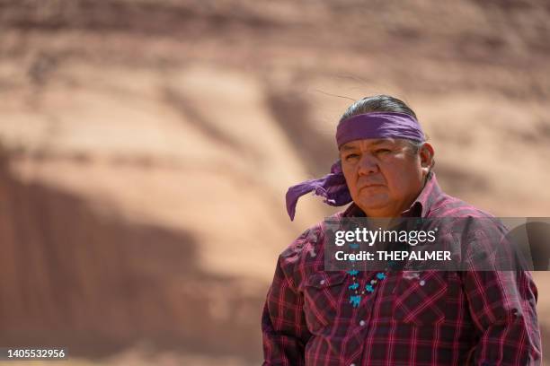 serious navajo man portrait in monument valley - native american culture pattern stock pictures, royalty-free photos & images