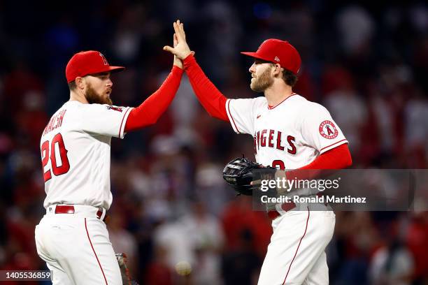 Taylor Ward and Jared Walsh of the Los Angeles Angels celebrate a 4-3 win against the Chicago White Sox in the ninth inning at Angel Stadium of...