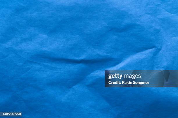 blue color eco recycled kraft paper sheet texture cardboard background. - kraft paper stockfoto's en -beelden