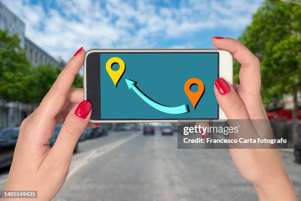 woman's hand with navigation route with mobile phone - san diego digital road map stock pictures, royalty-free photos & images