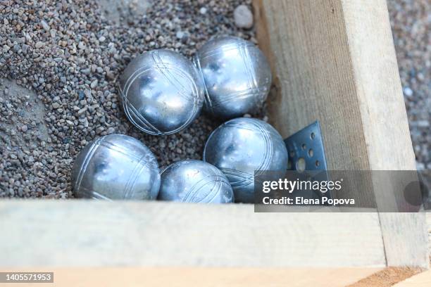 petanque ball boules on petanque field - petanque court stock pictures, royalty-free photos & images