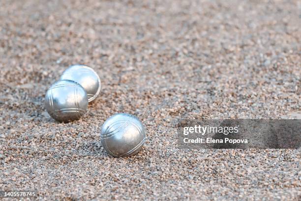 petanque ball boules on petanque field - petanque court stock pictures, royalty-free photos & images