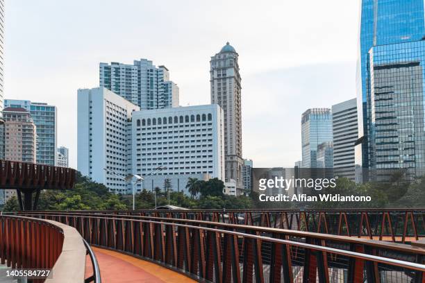 footbridge and skyscrapers - jakarta empty stock pictures, royalty-free photos & images