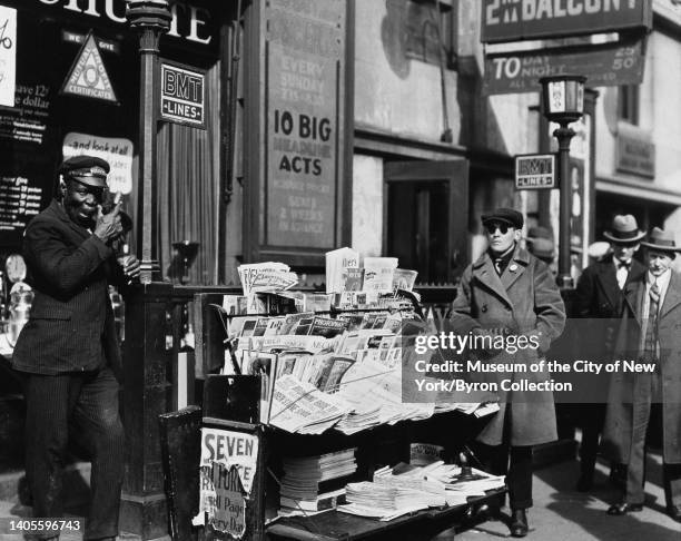 Blind news dealer at his stand on 7th Avenue near 47th Street in New York City, US, 1926.