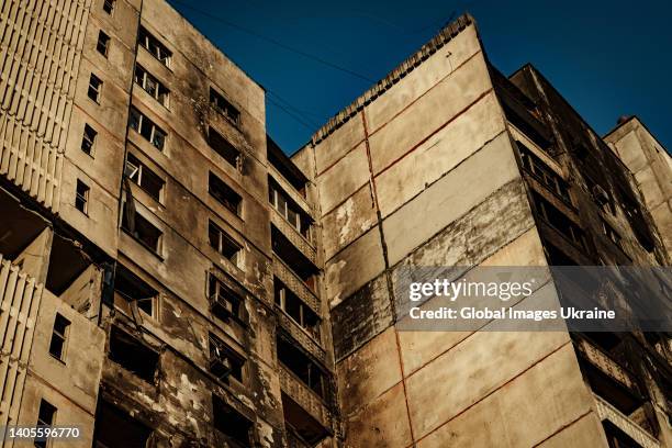 An exterior view of a damaged apartment building by shelling on June 7, 2022 in Kharkiv, Ukraine. Pivnichna Saltivka is a residential district in...