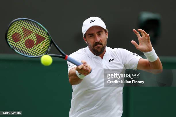 Steve Johnson of United States of America plays a forehand against Grigor Dimitrov of Bulgaria during Men's Singles First Round match on day two of...