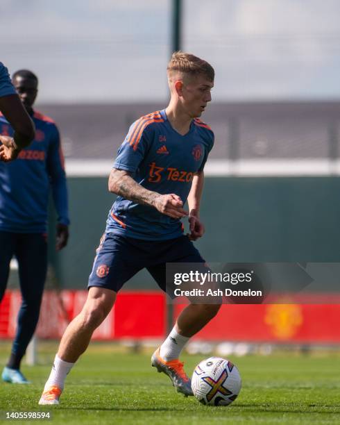 Ethan Galbraith of Manchester United in action during a first team training session at Carrington Training Ground on June 27, 2022 in Manchester,...