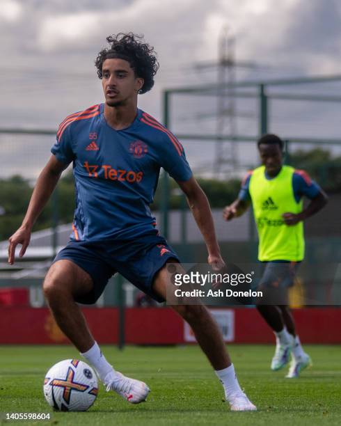 Zidane Iqbal of Manchester United in action during a first team training session at Carrington Training Ground on June 27, 2022 in Manchester,...