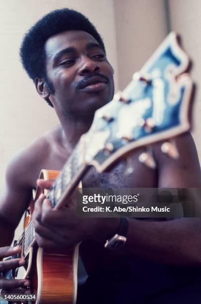 George Benson plays the guitar naked, unknown, 1972.