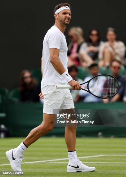 Grigor Dimitrov of Bulgaria reacts during their Men's Singles First Round match against Steve Johnson of United States of America on day two of The...