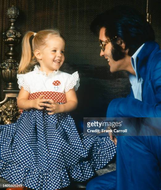 American rock legend Elvis Presley with his daughter Lisa-Marie Presley, during the week of Thanksgiving 1970 at the Presley's California home at...