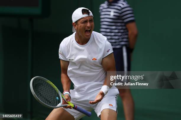 Ryan Peniston of Great Britain celebrates winning match point against Henri Laaksonen of Switzerland during their Men's Singles First Round Match on...