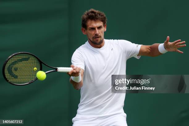 Henri Laaksonen of Switzerland plays a forehand against Ryan Peniston of Great Britain during their Men's Singles First Round Match on day two of The...