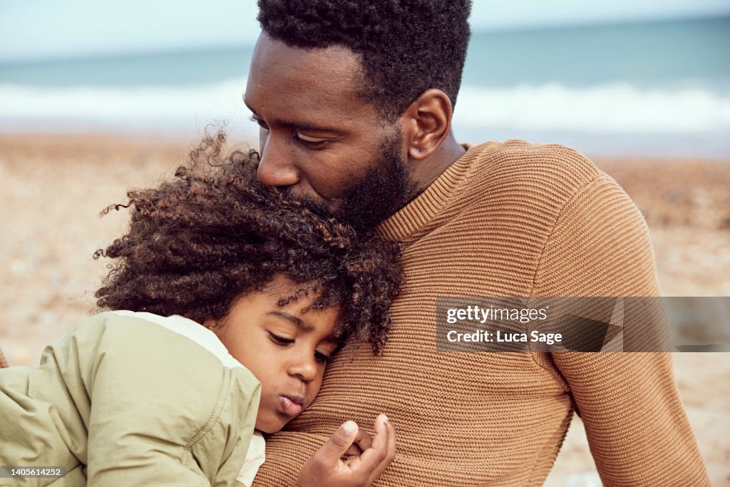 Father and son sharing a moment on the beach