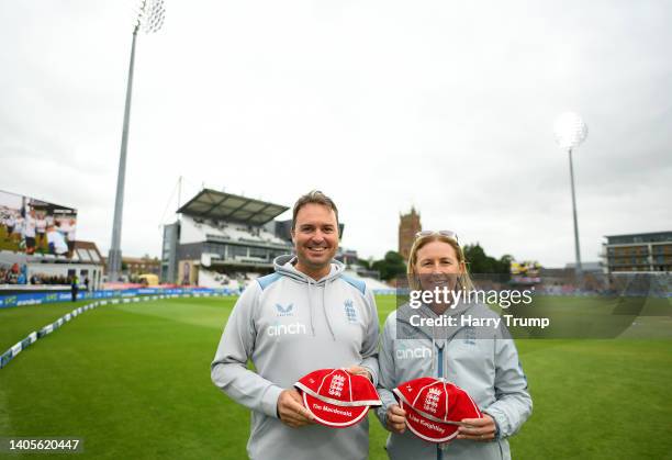 Lisa Keightley, Head Coach of England and Tim Macdonald pose for a photo after being presented with their Coaching Caps by Professor John Neal, Head...