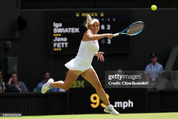 Jana Fett of Croatia plays a forehand against Iga Swiatek of Poland during their Women's Singles First Round Match on day two of The Championships...