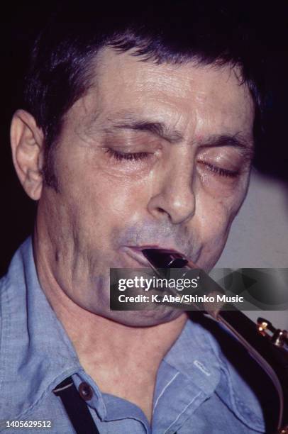 Art Pepper plays the alto sax in blue shirt, close up, unknown, circa 1970s.