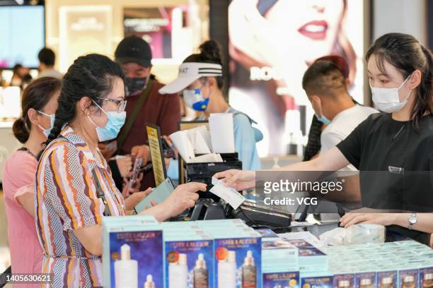 Customers shop during the first Hainan International Offshore Duty Free Shopping Festival at Sanya International Duty Free City on June 28, 2022 in...