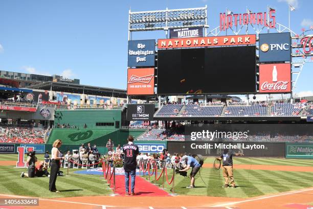 Former Washington Nationals Ryan Zimmerman walk to the stage during his retirement ceremony before a baseball game against the Philadelphia Phillies...