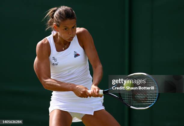 Chloe Paquet of France plays a backhand against Irina Bara of Romania during their Women's Singles First Round Match on day two of The Championships...
