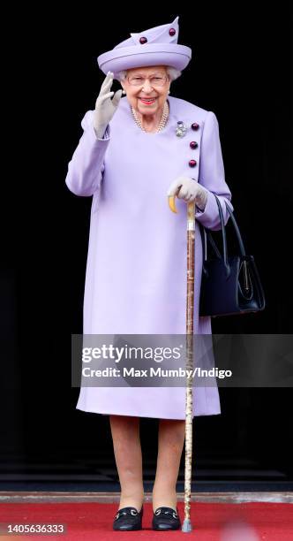 Queen Elizabeth II attends an Armed Forces Act of Loyalty Parade in the gardens of the Palace of Holyroodhouse on June 28, 2022 in Edinburgh,...