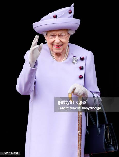 Queen Elizabeth II attends an Armed Forces Act of Loyalty Parade in the gardens of the Palace of Holyroodhouse on June 28, 2022 in Edinburgh,...