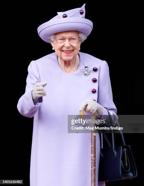 Queen Elizabeth II attends an Armed Forces Act of Loyalty Parade in the gardens of the Palace of Holyroodhouse on June 28, 2022 in Edinburgh,...