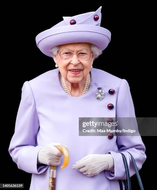 Queen Elizabeth II attends an Armed Forces Act of Loyalty Parade in the gardens of the Palace of Holyroodhouse on June 28, 2022 in Edinburgh,...