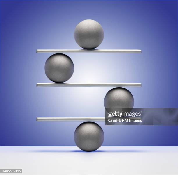 balance concept with balls - lever stock pictures, royalty-free photos & images