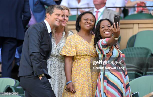 Bear Grylls and Shara Grylls pose with guests as they attend Day Two of Wimbledon 2022 at the All England Lawn Tennis and Croquet Club on June 28,...