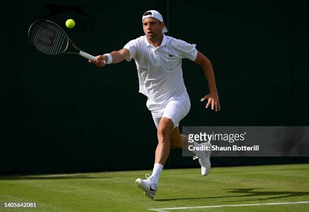 Filip Krajinovic of Serbia plays a forehand against Jiri Lehecka of Czech Republic during their Men's Singles First Round Match on day two of The...