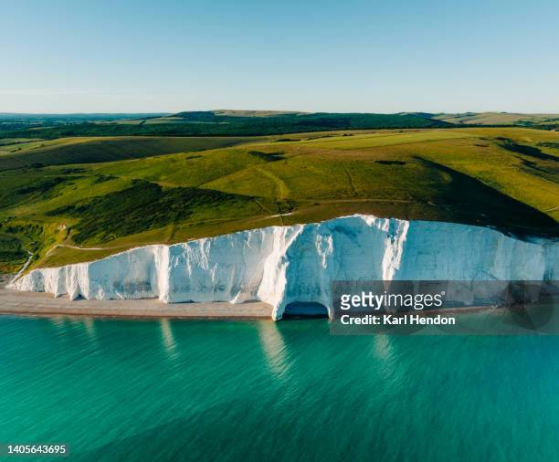 a daytime elevated view of the seven sisters cliffs on the east sussex coast, uk - sussex stock pictures, royalty-free photos & images