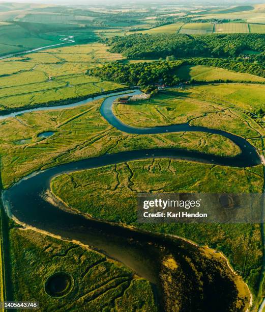 an aerial view of the cuckmere river in east sussex uk - aerial view uk stock pictures, royalty-free photos & images