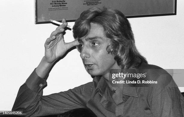 American singer Barry Manilow speaks with an interviewer in his Manhattan apartment, 26th December 1973.