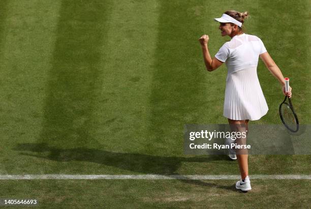 Simona Halep of Romania celebrates winning match point against Karolina Muchova of Czech Republic during their Women's Singles First Round Match on...