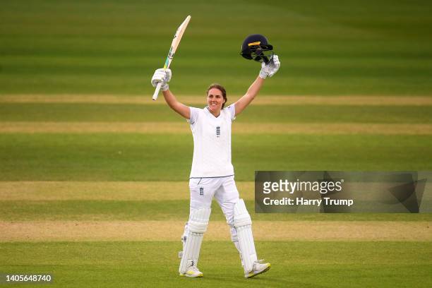 Nat Sciver of England celebrates their century during Day Two of the First Test Match between England Women and South Africa Women at The Cooper...