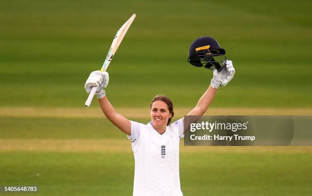 Nat Sciver of England celebrates their century during Day Two of the First Test Match between England Women and South Africa Women at The Cooper...