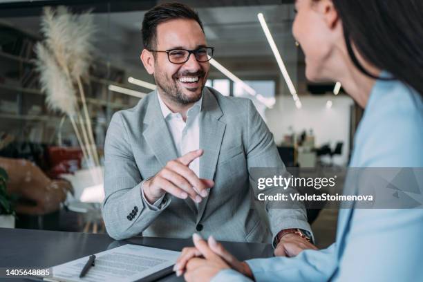 business people signing a contract. - staffing services stock pictures, royalty-free photos & images