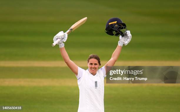 Nat Sciver of England celebrates their century during Day Two of the First Test Match between England Women and South Africa Women at The Cooper...