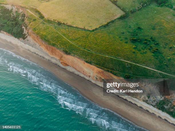 a sunset view of the sea and isle of wight coastline - sandown isle of wight stock pictures, royalty-free photos & images