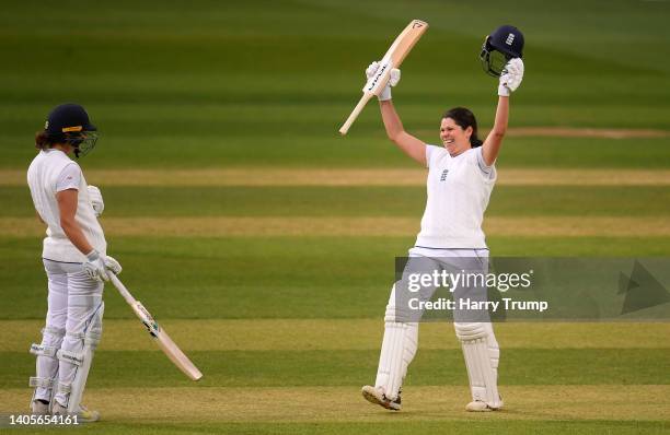 Alice Davidson-Richards of England celebrates their century during Day Two of the First Test Match between England Women and South Africa Women at...